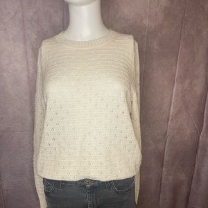 White knitted sweater.